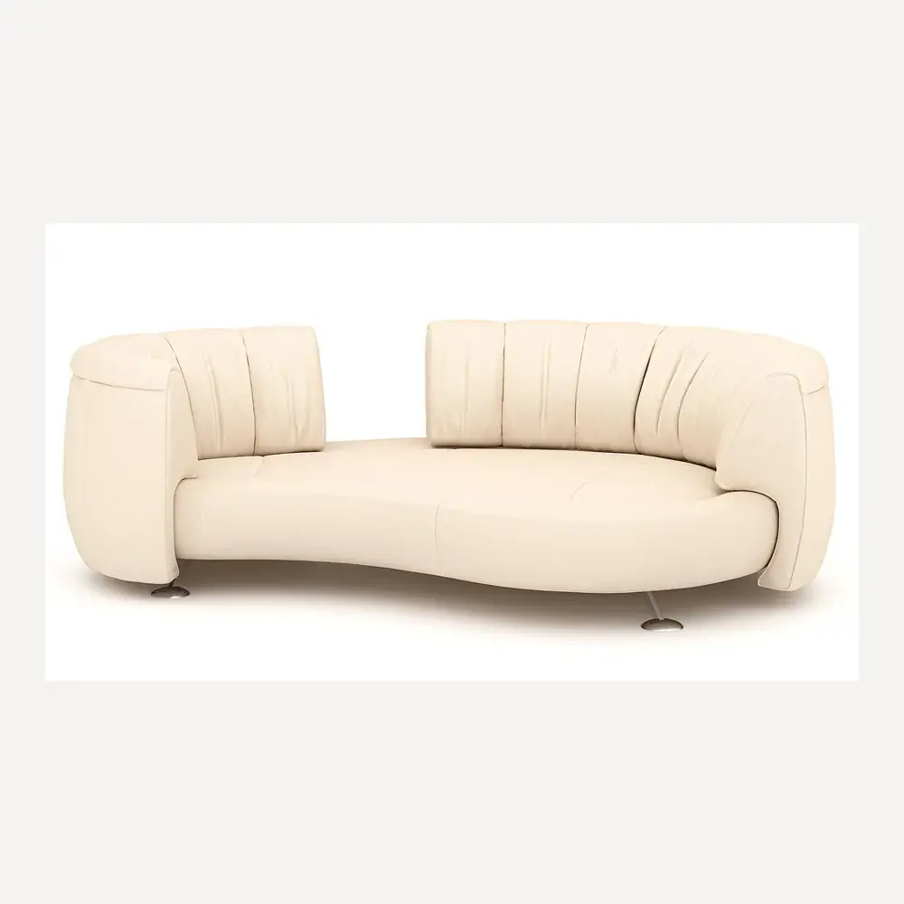 Ein cremefarbenes Ledersofa von Desede Switzerland mit geschwungenem Design und eleganten Metallfüßen.