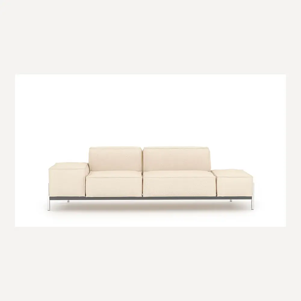 Helle Lederchaiselongue von Desede Switzerland mit schwarzem Gestell und Edelstahlfüßen.
