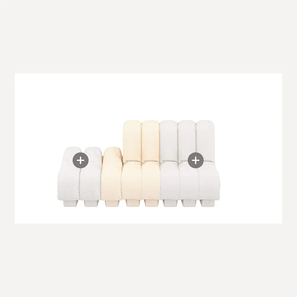 Helles, modulares Stoffsofa von Desede Switzerland mit flexiblen Sitzmodulen.