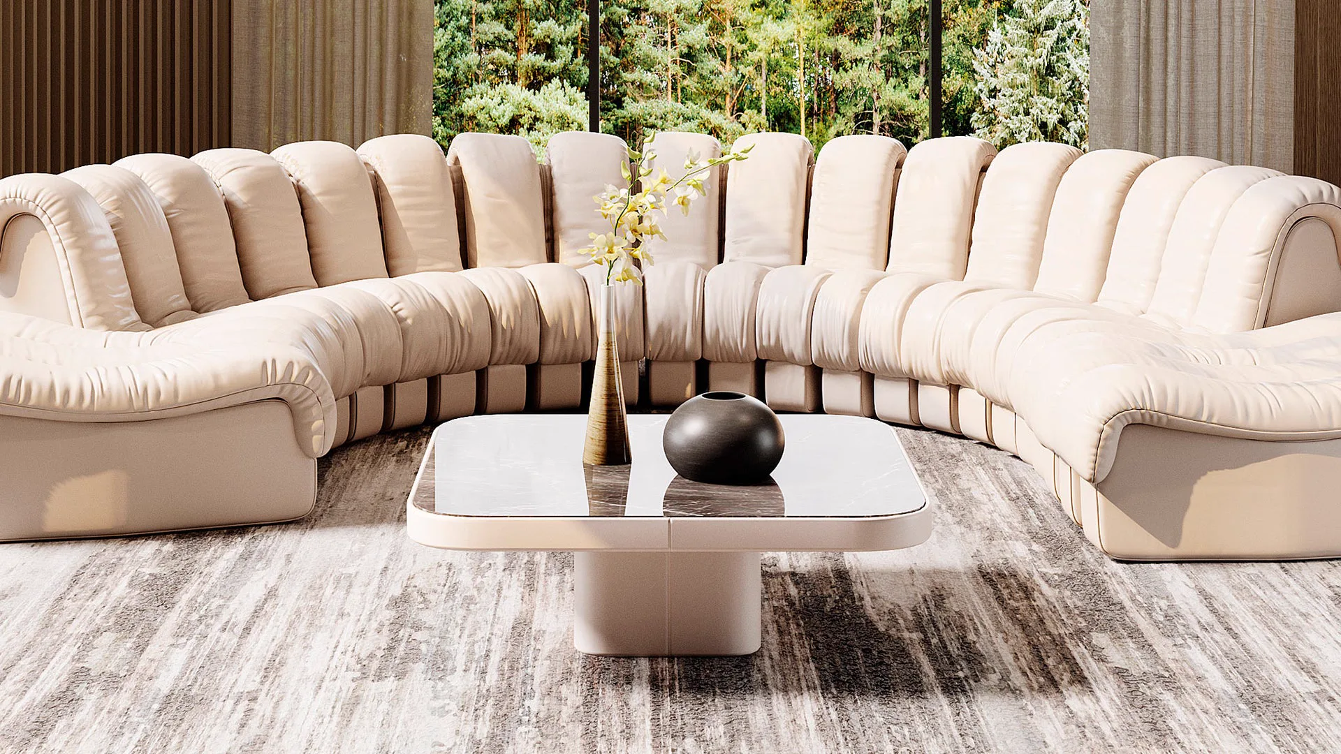 Beiges Ledersofa von Desede Switzerland mit geschwungenem Design und passendem Couchtisch.