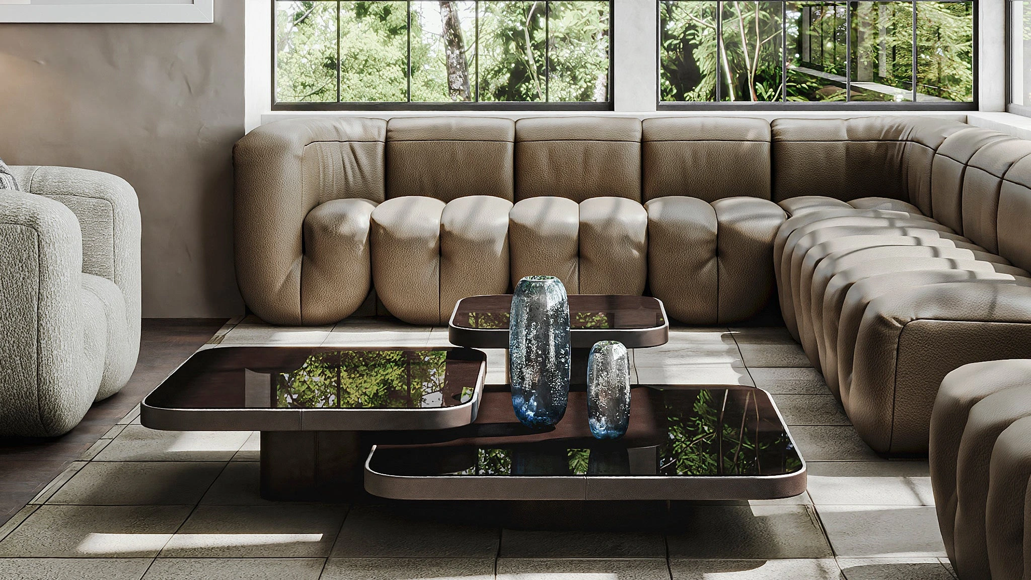 Ein beiges Ledersofa von Desede Switzerland mit eleganten Couchtischen im modernen Design.